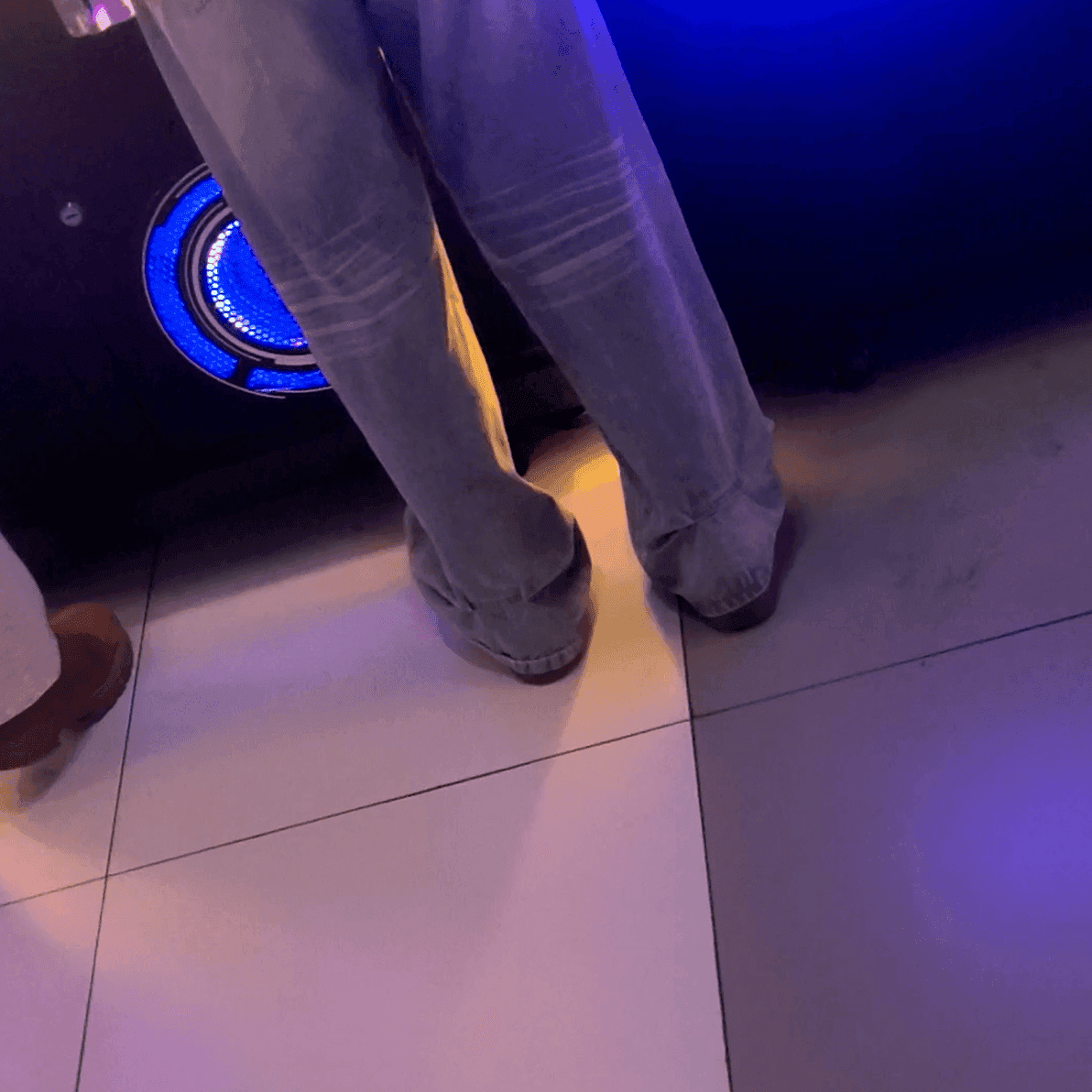 Game arcade lady in sneakers and leather shoes candid crush and stuck to soles