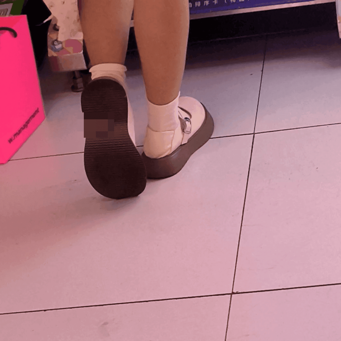 Game arcade lady in sneakers and leather shoes candid crush and stuck to soles