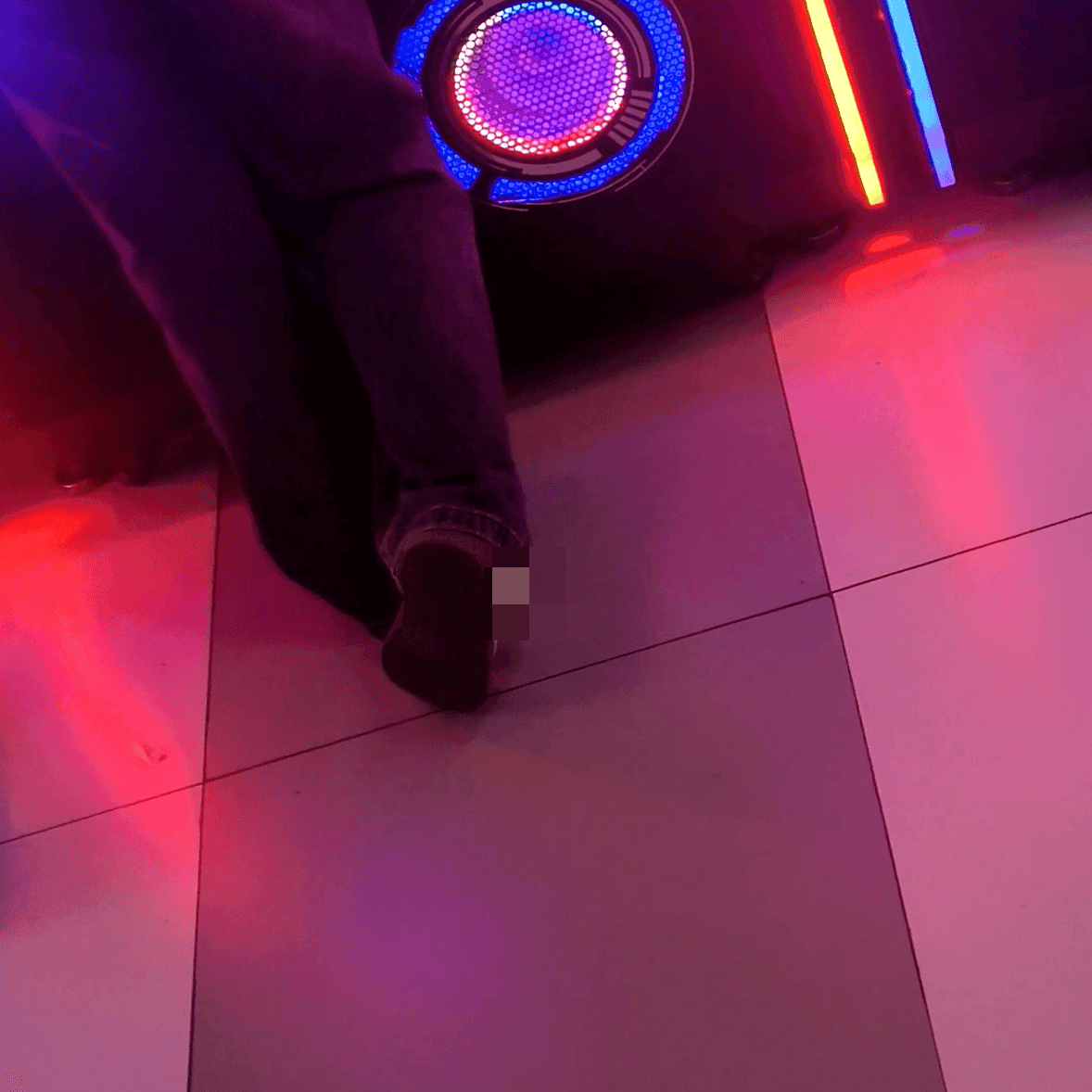Game arcade lady in sandals and leather shoes candid crush and stuck to soles