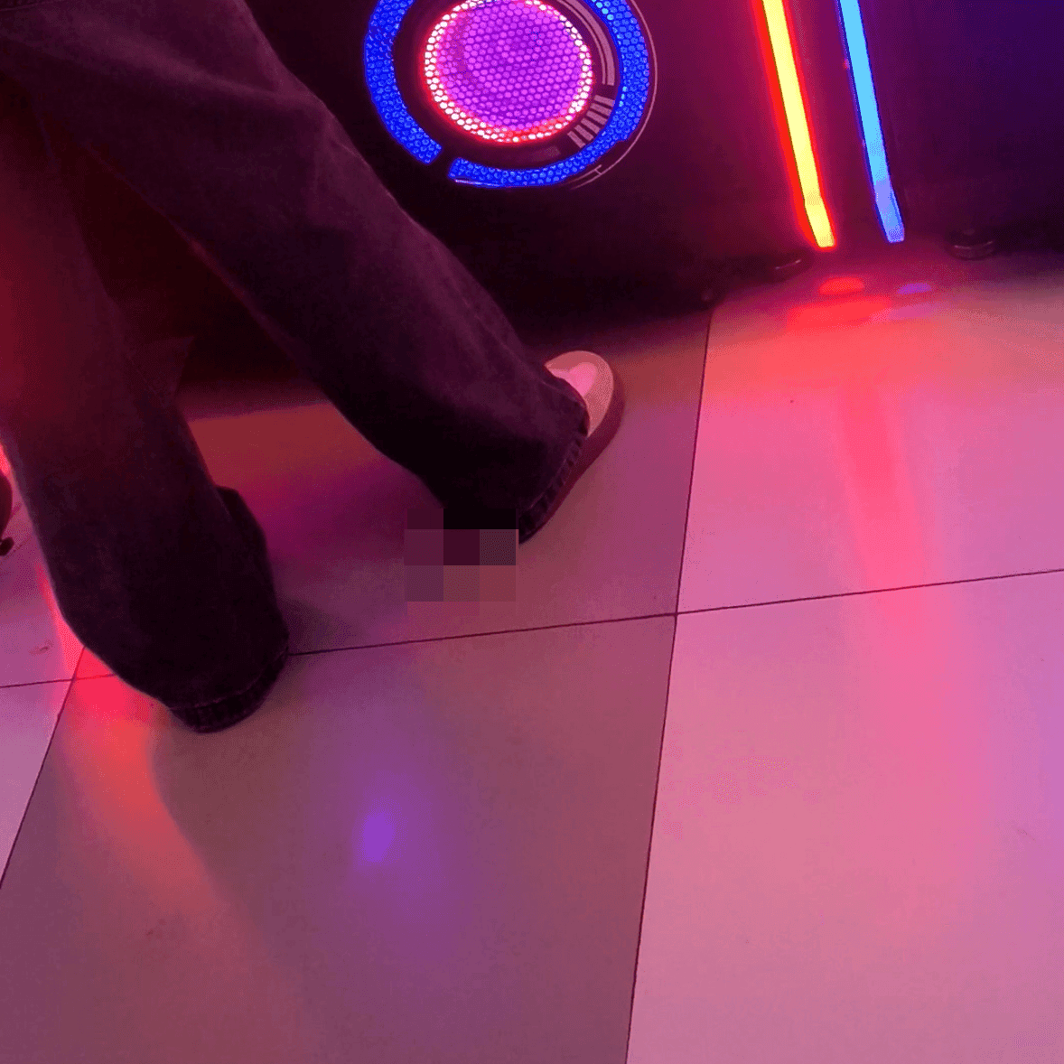 Game arcade lady in sandals and leather shoes candid crush and stuck to soles