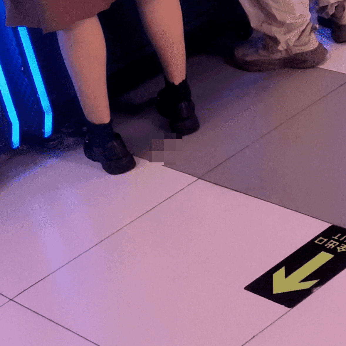 Game arcade lady in sandals and leather shoes candid crush and stuck to soles