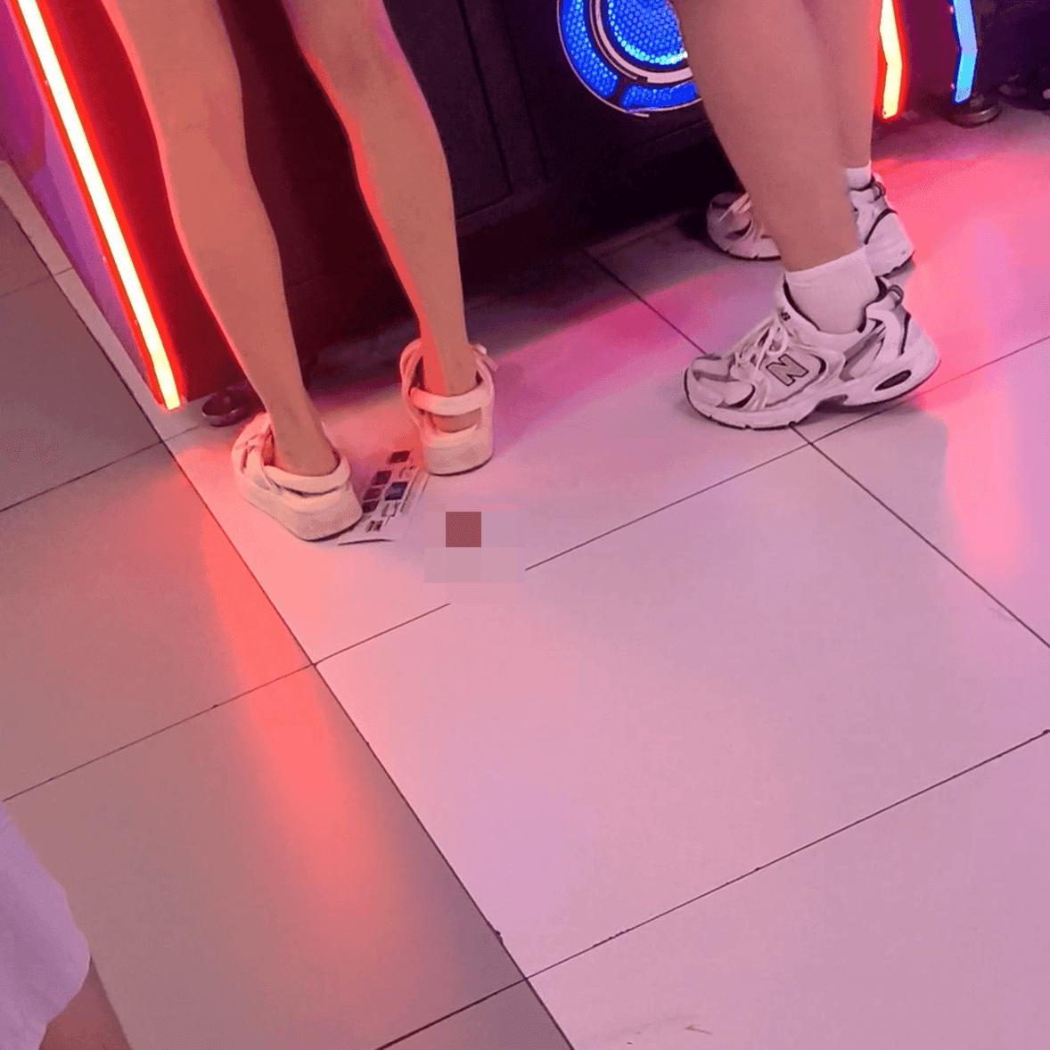 Game arcade lady in sandals and leather shoes candid crush and stuck to soles