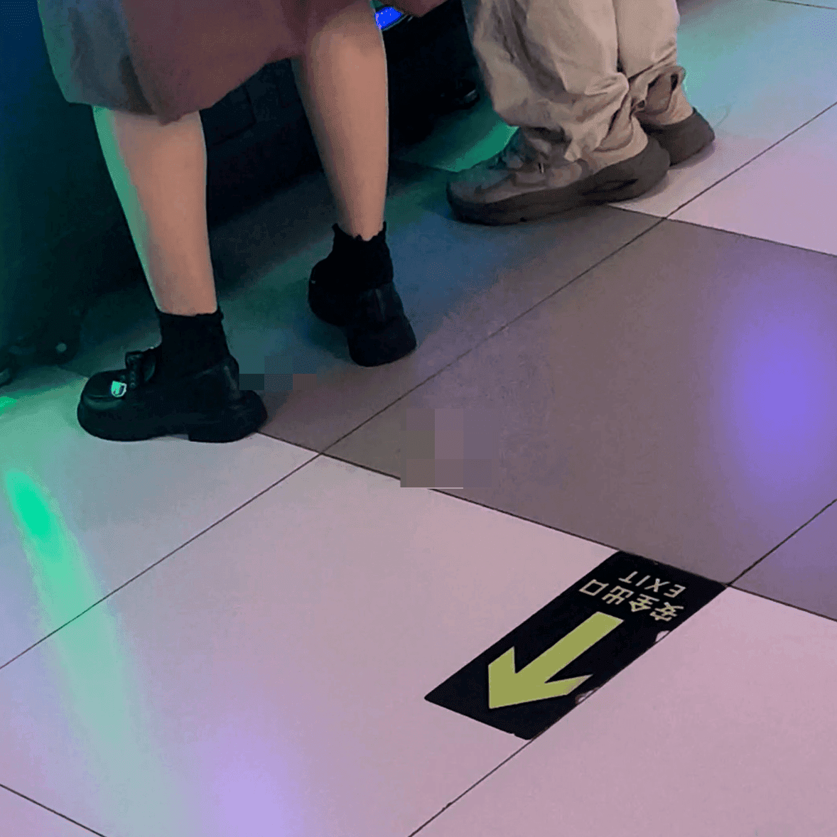 Game arcade lady in sandals and leather shoes candid crush and stuck to soles