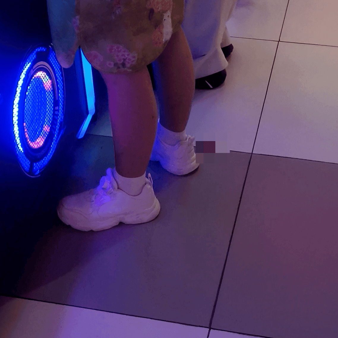 Game arcade young lady in sneakers candid crush and rub