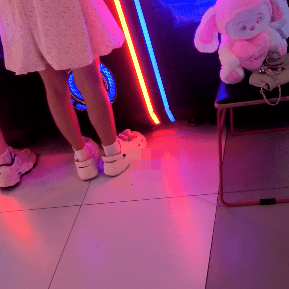 Game arcade young lady in sneakers candid crush and rub