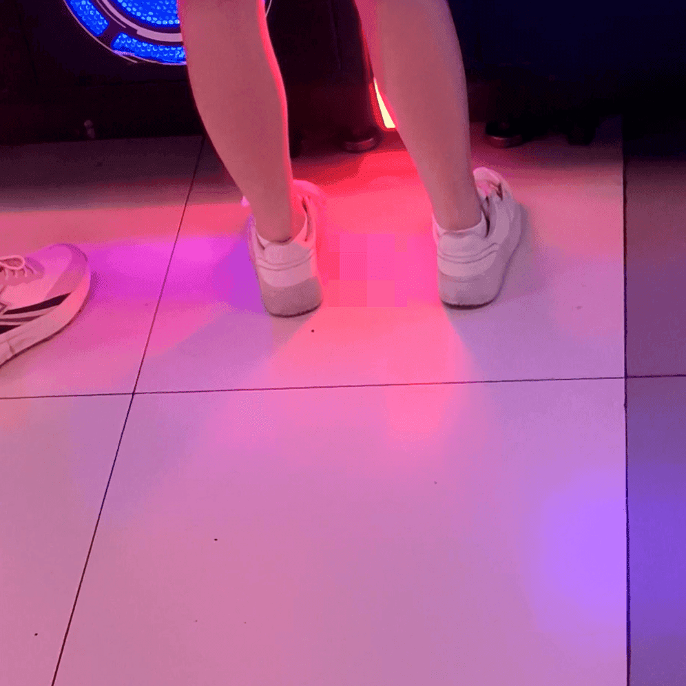 Game arcade young lady in sneakers candid crush and rub