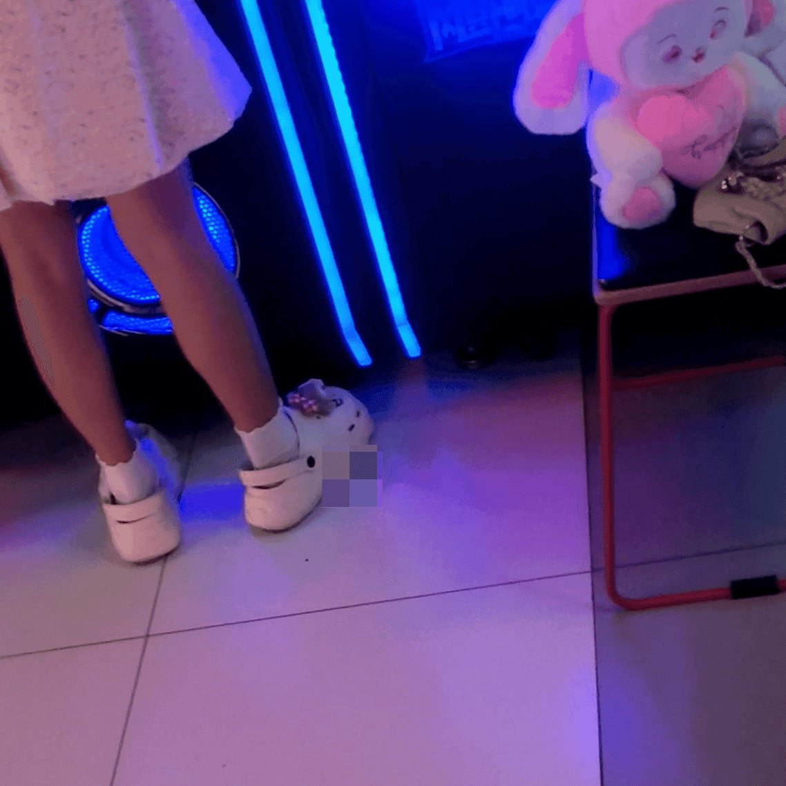 Game arcade young lady in sneakers candid crush and rub