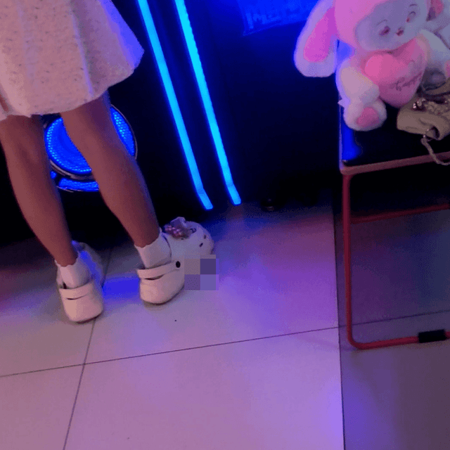 Game arcade young lady in sneakers candid crush and rub