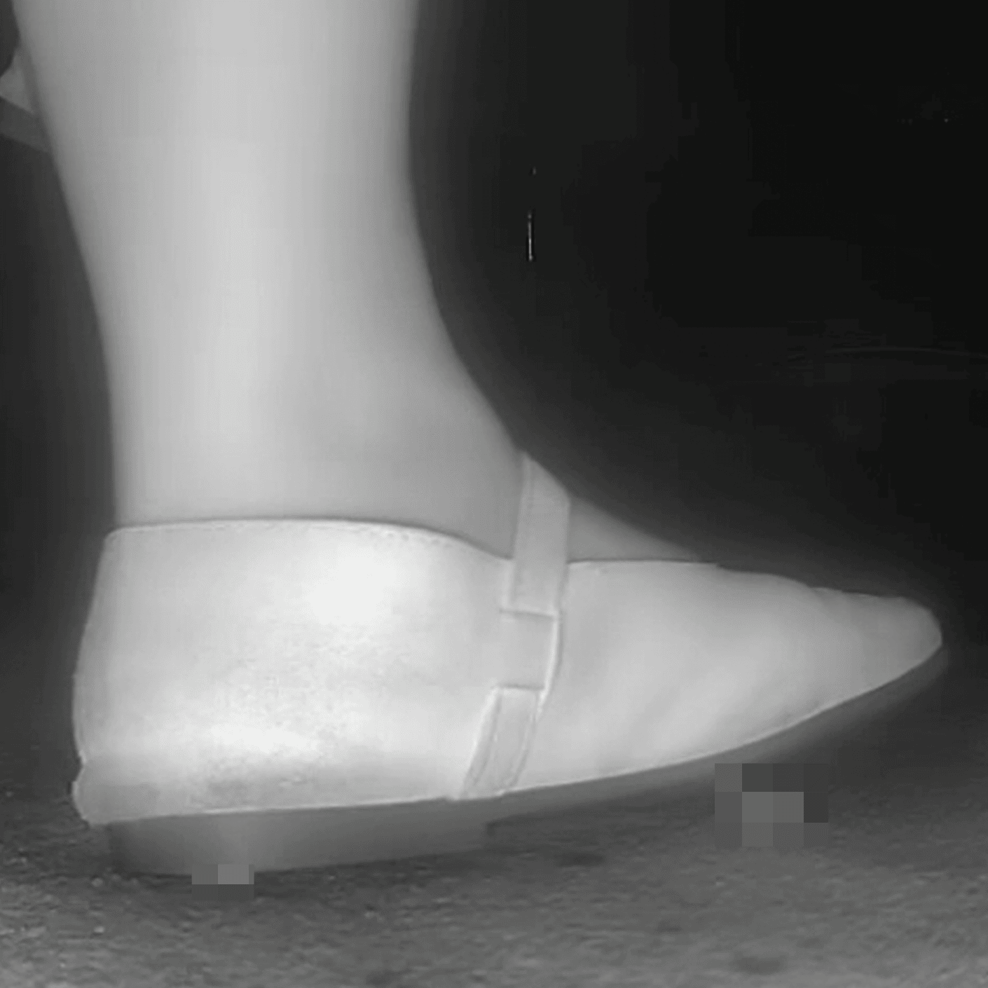 Woman candid crush with flat shoes at the cinema