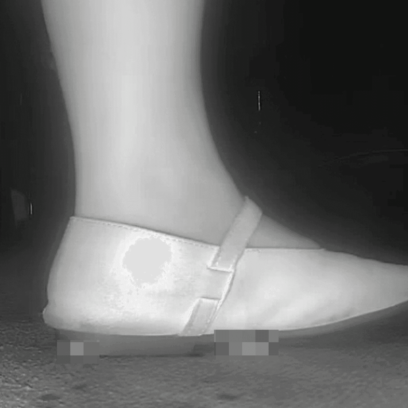 Woman candid crush with flat shoes at the cinema