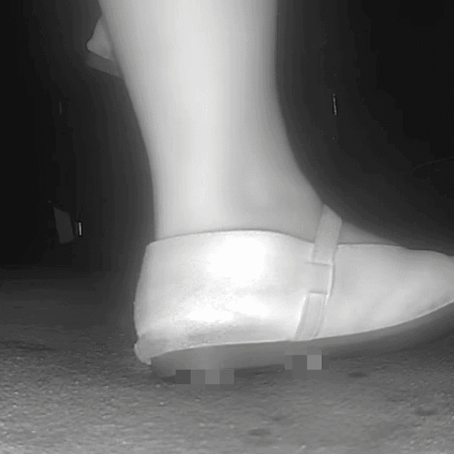 Woman candid crush with flat shoes at the cinema