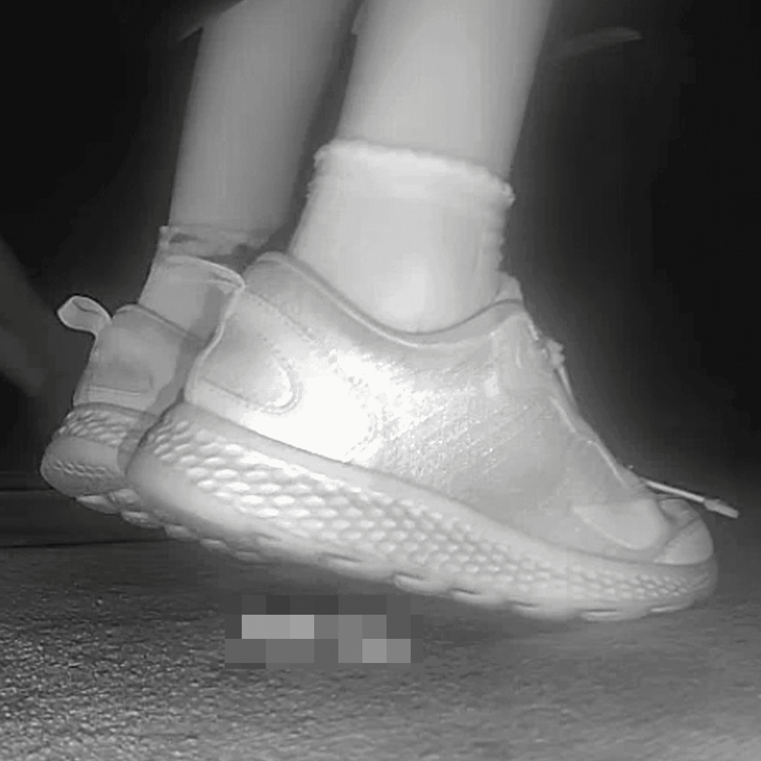 Young lady in sneakers candid crush at the cinema