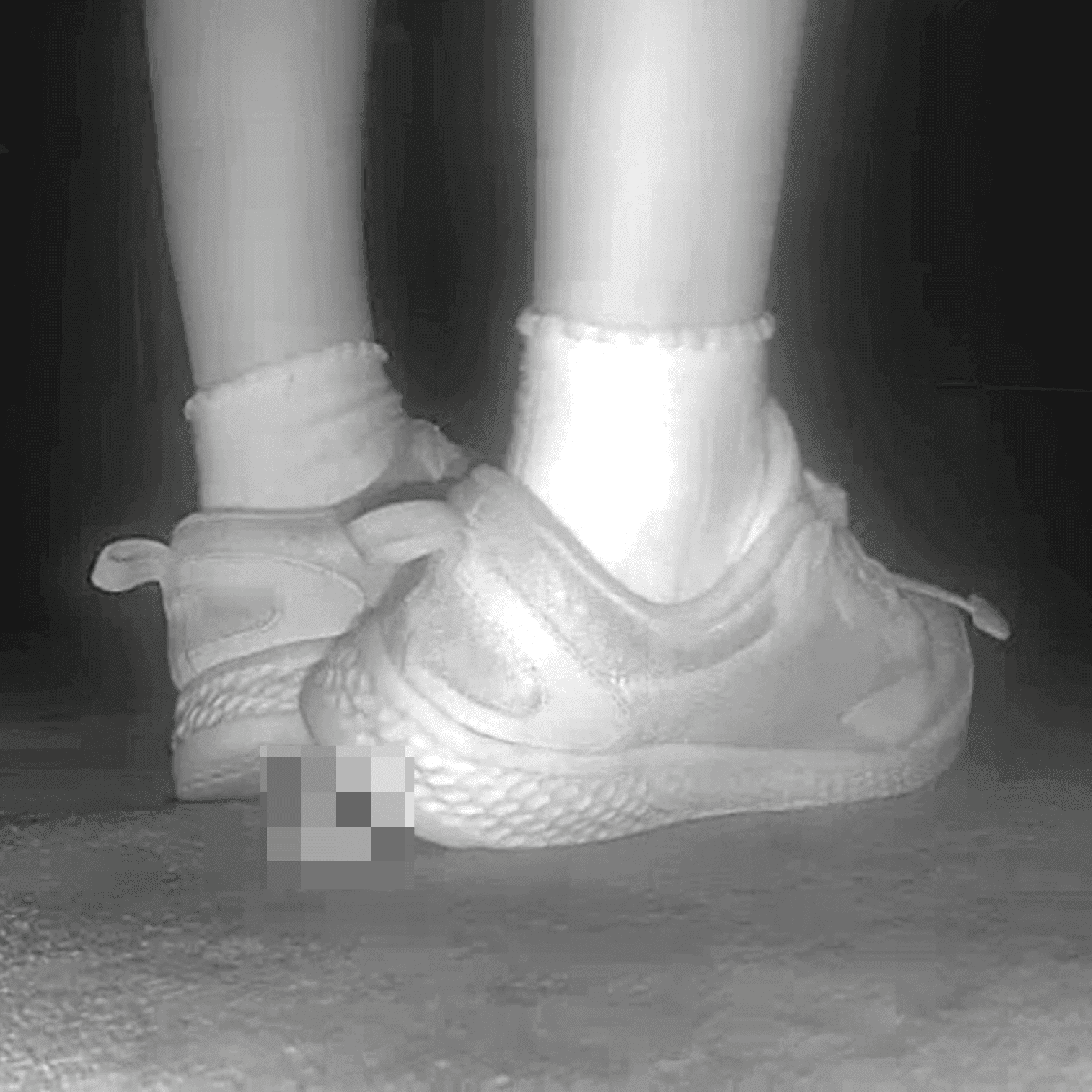 Young lady in sneakers candid crush at the cinema