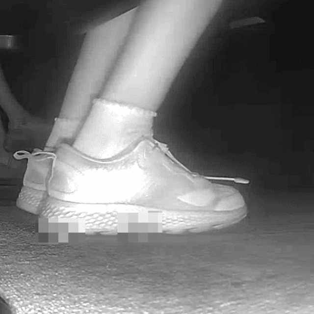 Young lady in sneakers candid crush at the cinema