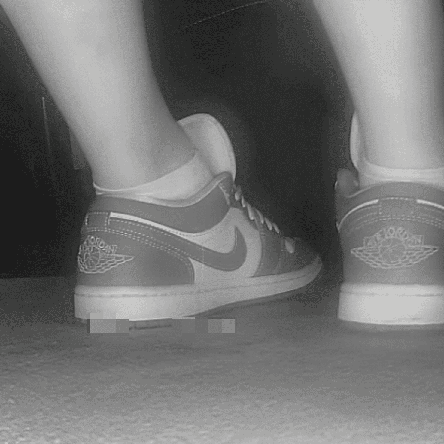 Woman in long dress candid crush with Air Jordan sneakers at the cinema