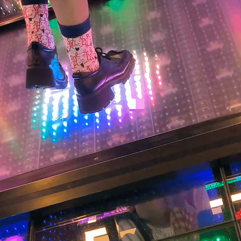 Dance machine woman candid crush with Adidas sneakers and long-sock leather shoes