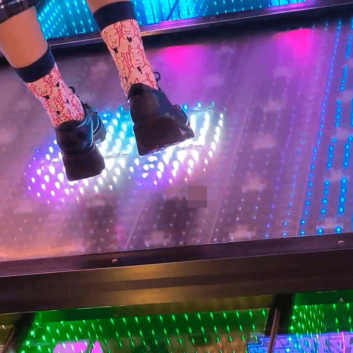 Dance machine woman candid crush with Adidas sneakers and long-sock leather shoes