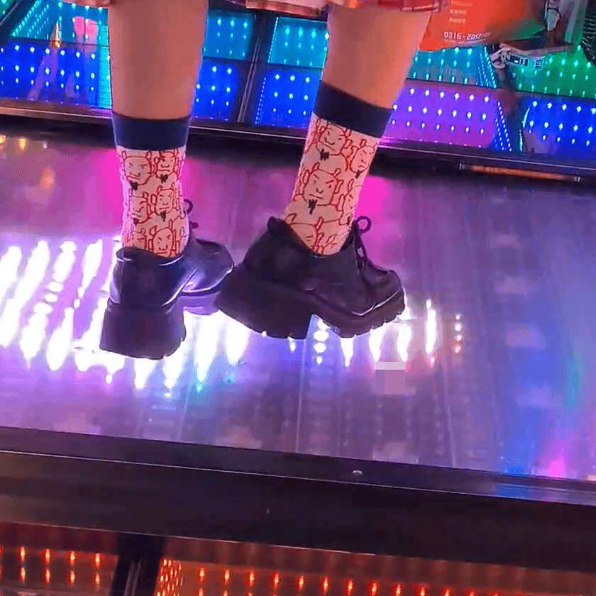 Dance machine woman candid crush with Adidas sneakers and long-sock leather shoes
