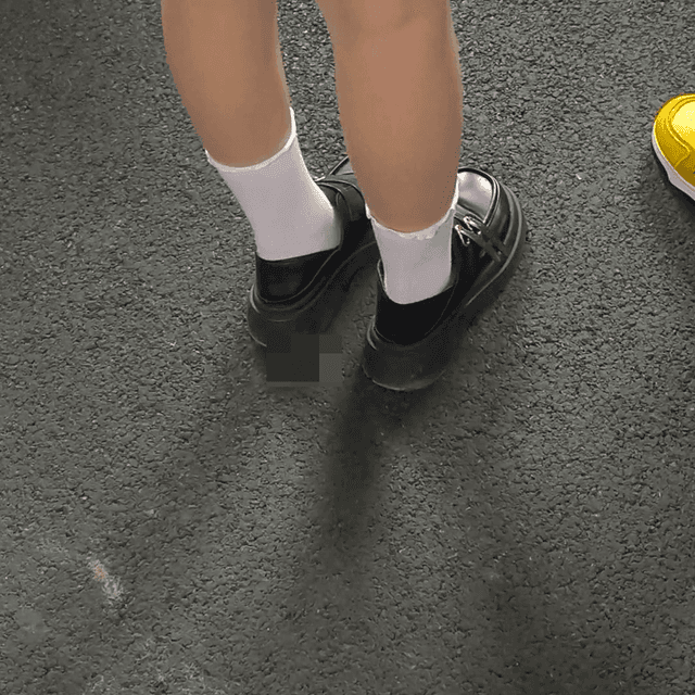 Outdoor plaza woman in leather shoes and high-top Converse candid crush and stuck to soles