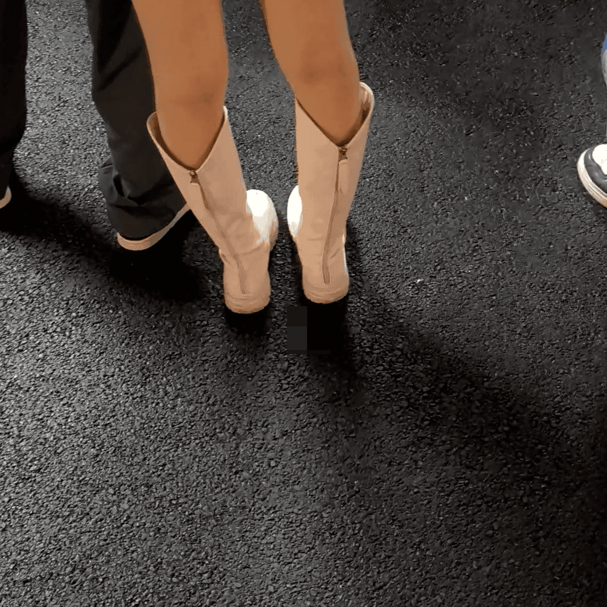 Outdoor plaza women in boots and leather shoes candid crush