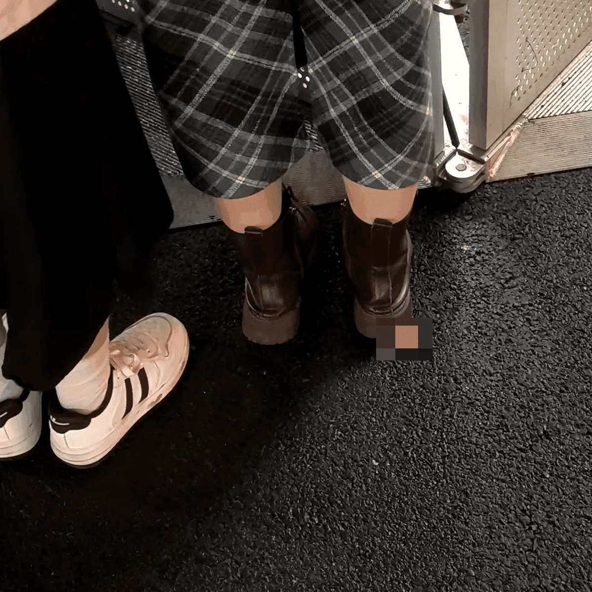 Outdoor plaza women in boots and leather shoes candid crush