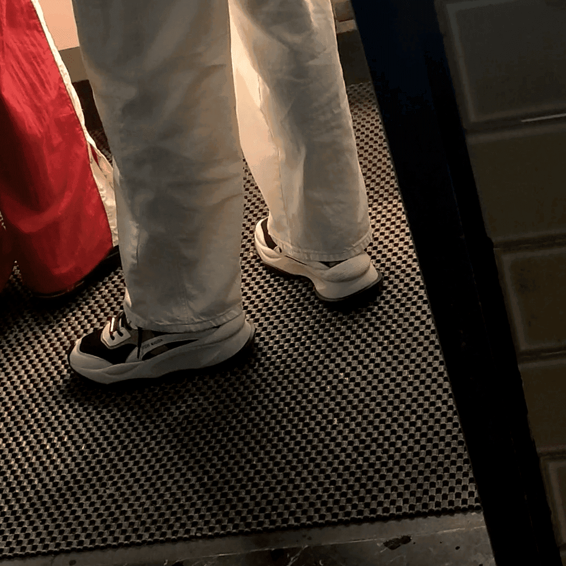 Multiple women in sneakers candid crush at the women's restroom entrance