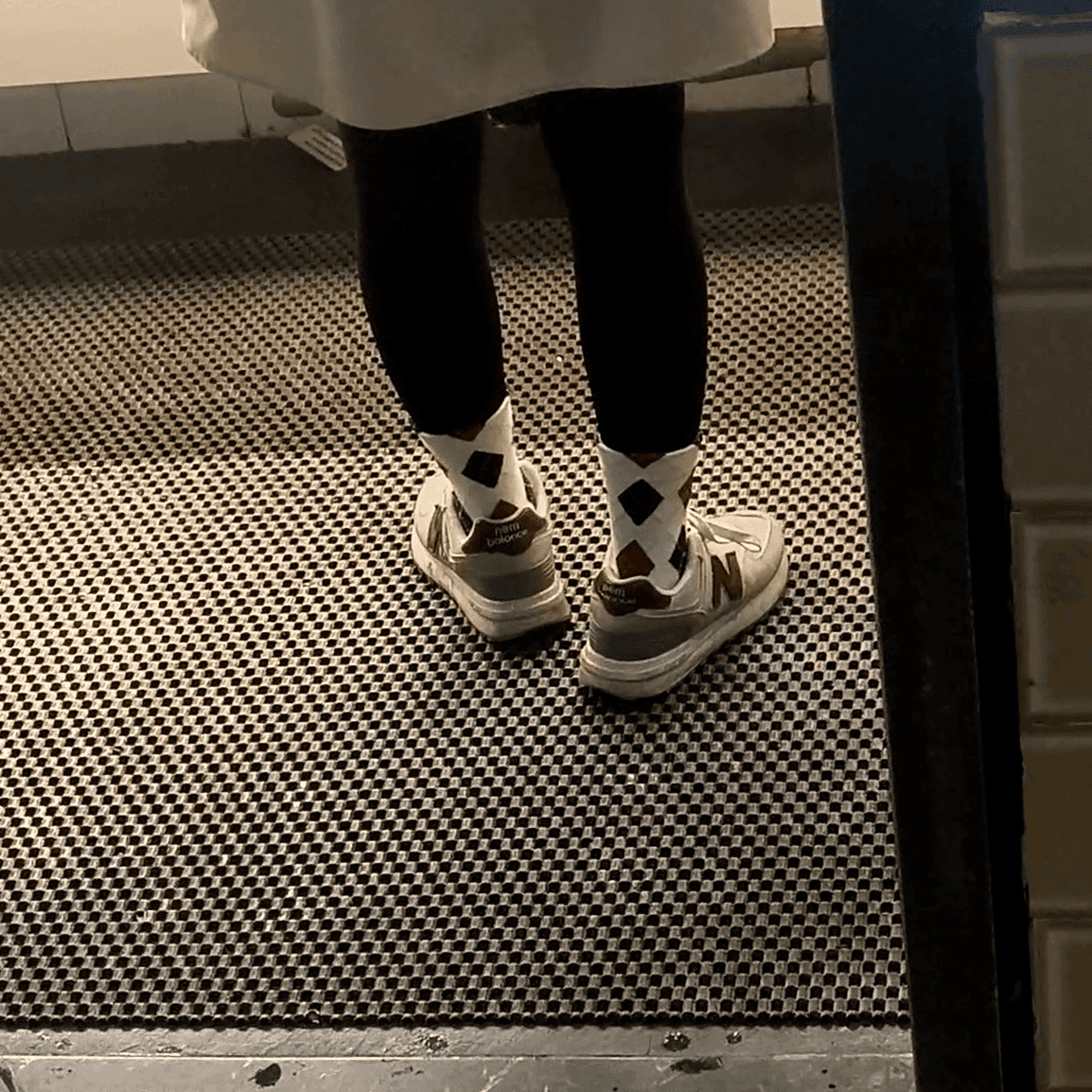 Multiple women in sneakers candid crush at the women's restroom entrance