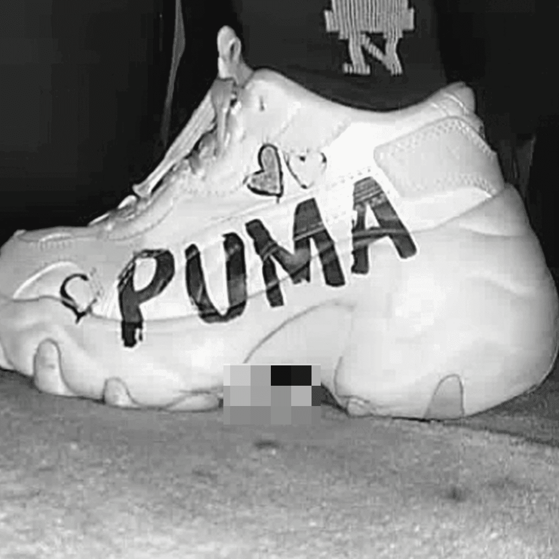 Woman with PUMA sneaker candid crush in the cinema