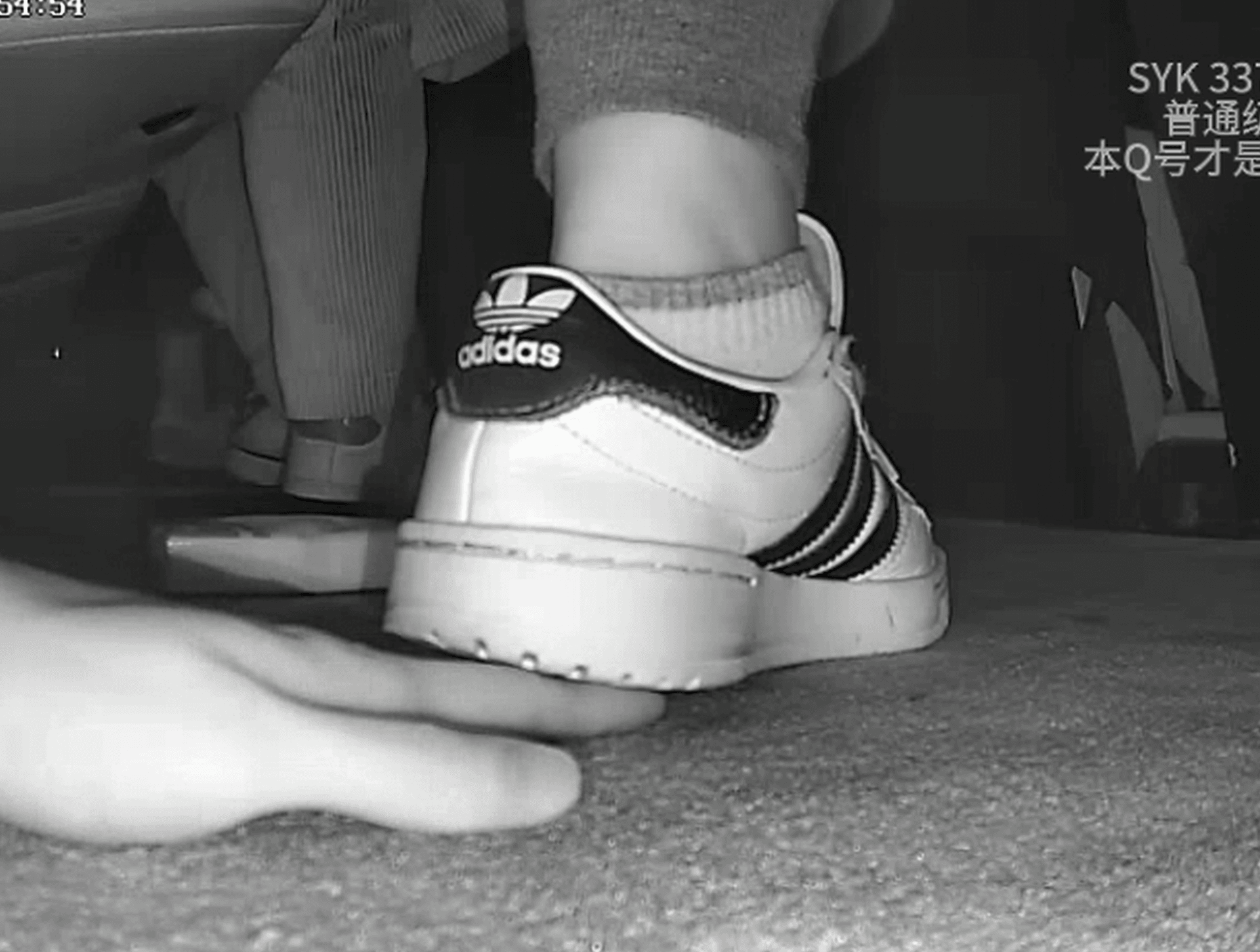Two girls in movie theater candid hand trample with Adidas + Gucci sneakers