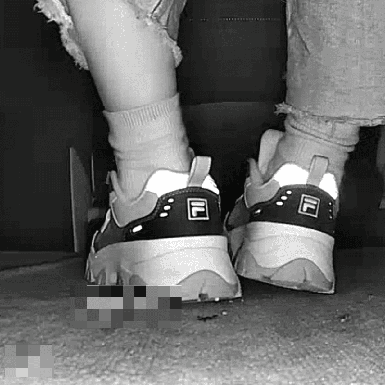 Beautiful woman wearing Fila sneaker candid crush in movie theater