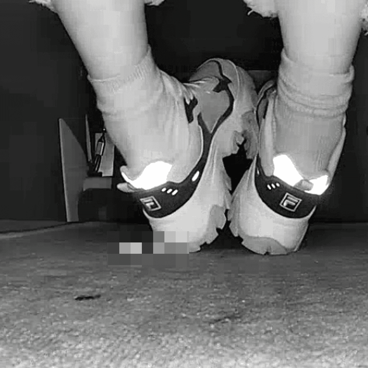 Beautiful woman wearing Fila sneaker candid crush in movie theater