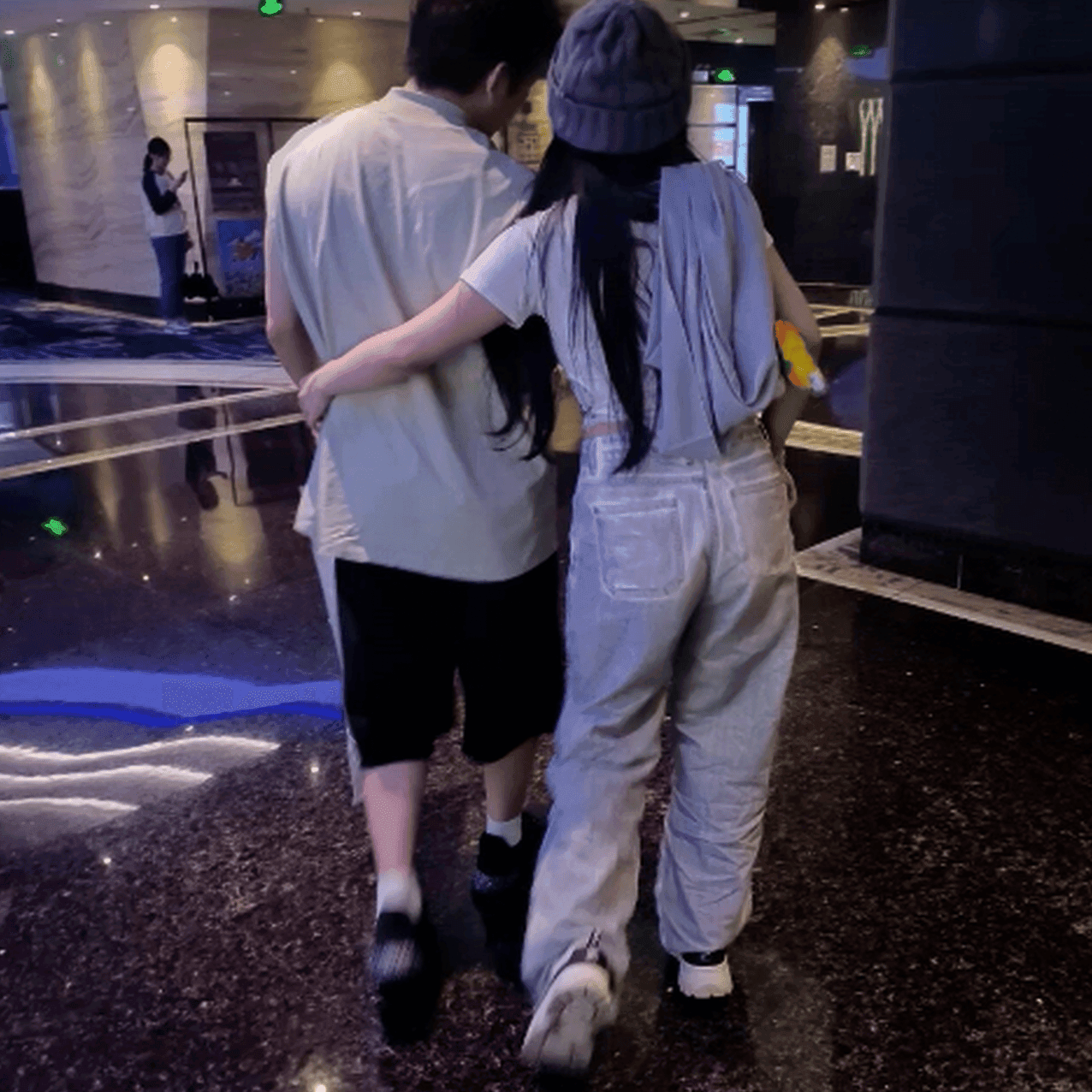 Beautiful woman wearing Fila sneaker candid crush in movie theater