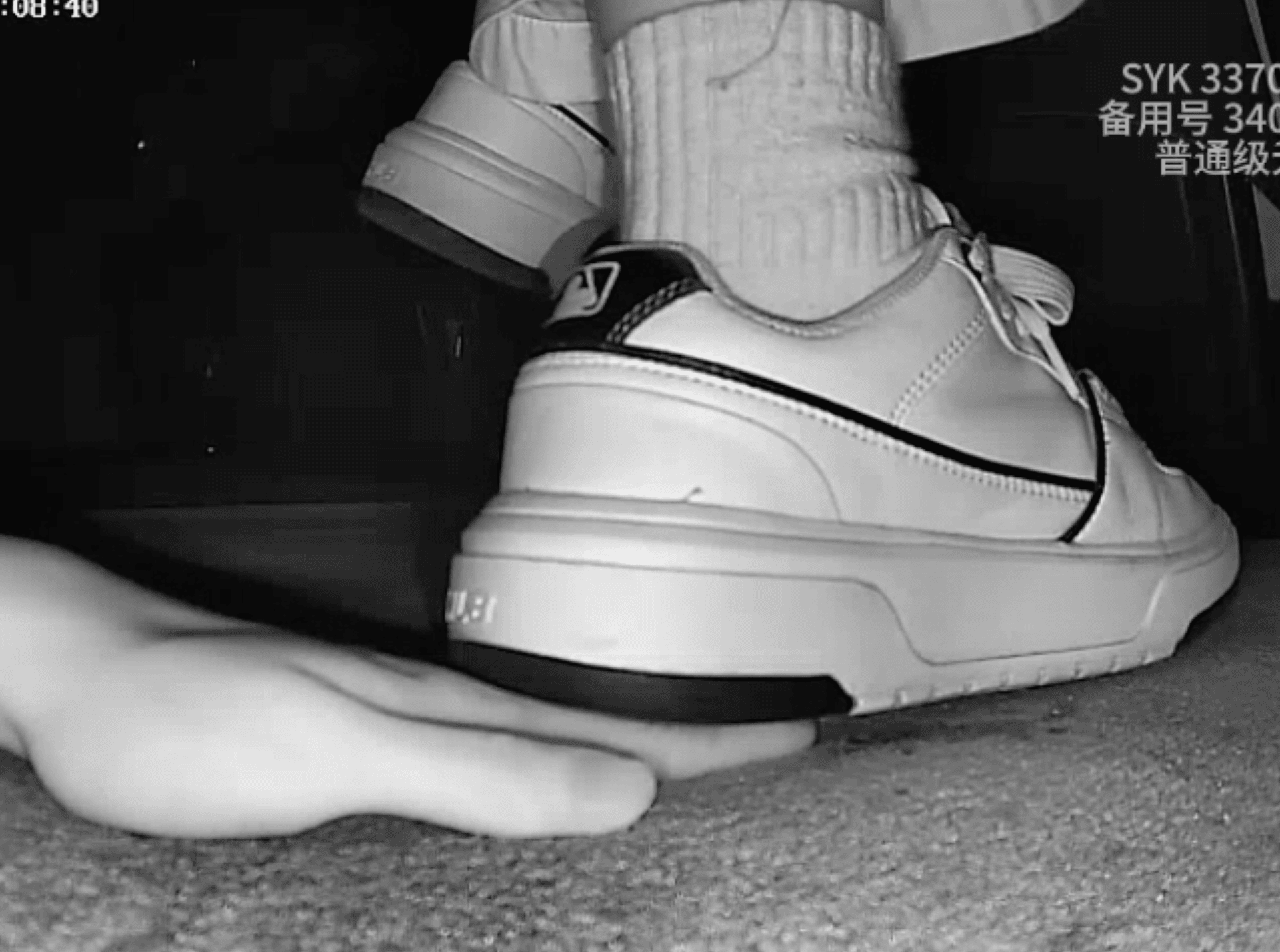 Two girls in the cinema with MLB sneakers and the white flat shoes candid trample on hand