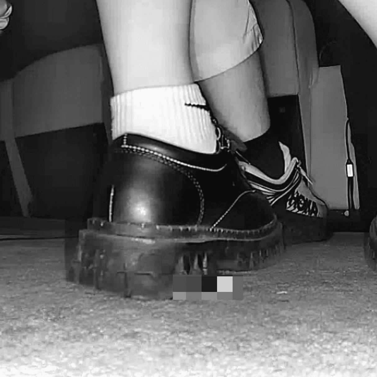Girl wearing white socks and leather shoes with her boyfriend candid crush at the cinema