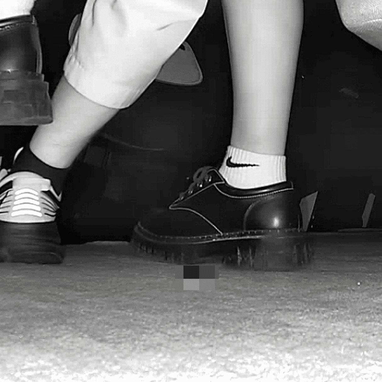 Girl wearing white socks and leather shoes with her boyfriend candid crush at the cinema