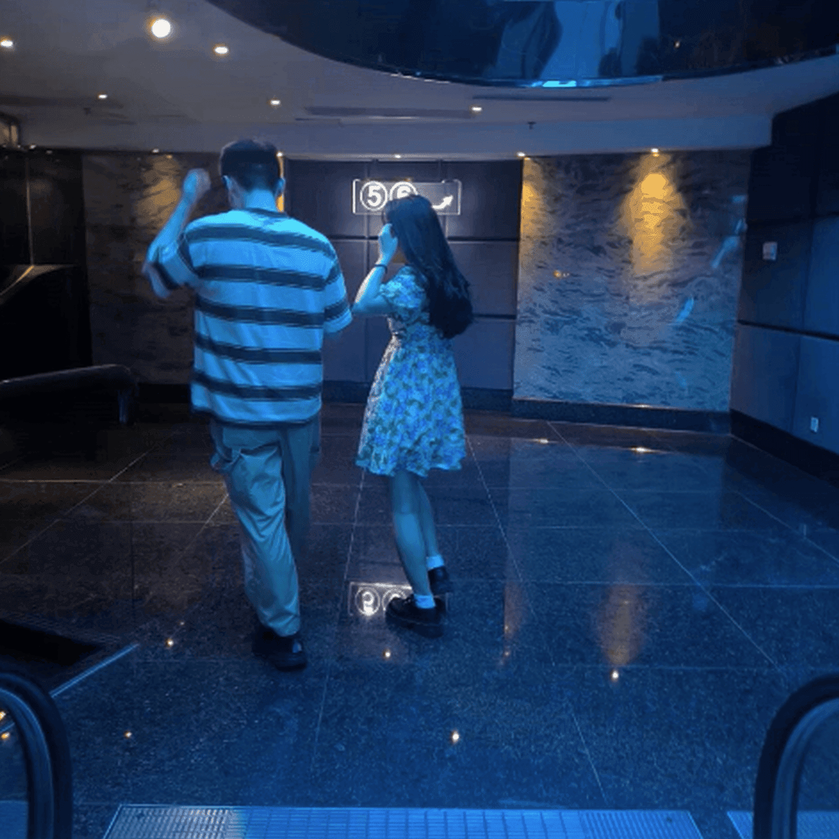 Girl wearing white socks and leather shoes with her boyfriend candid crush at the cinema