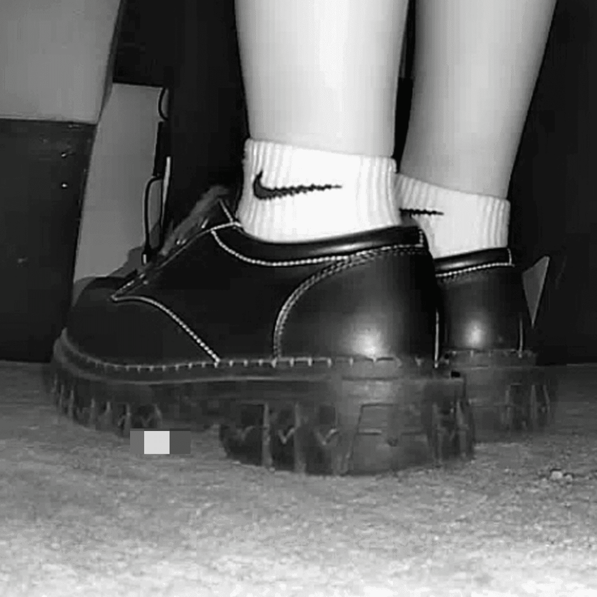 Girl wearing white socks and leather shoes with her boyfriend candid crush at the cinema