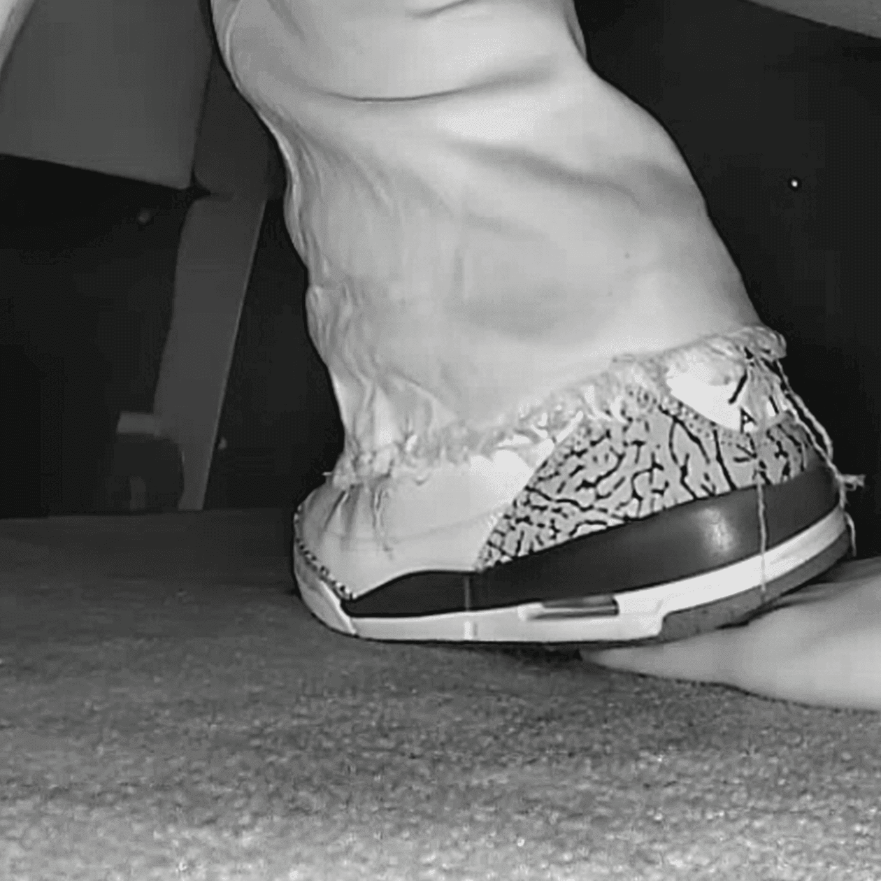 Girl in movie theater candid trample on hand with Nike Air Jordan sneakers