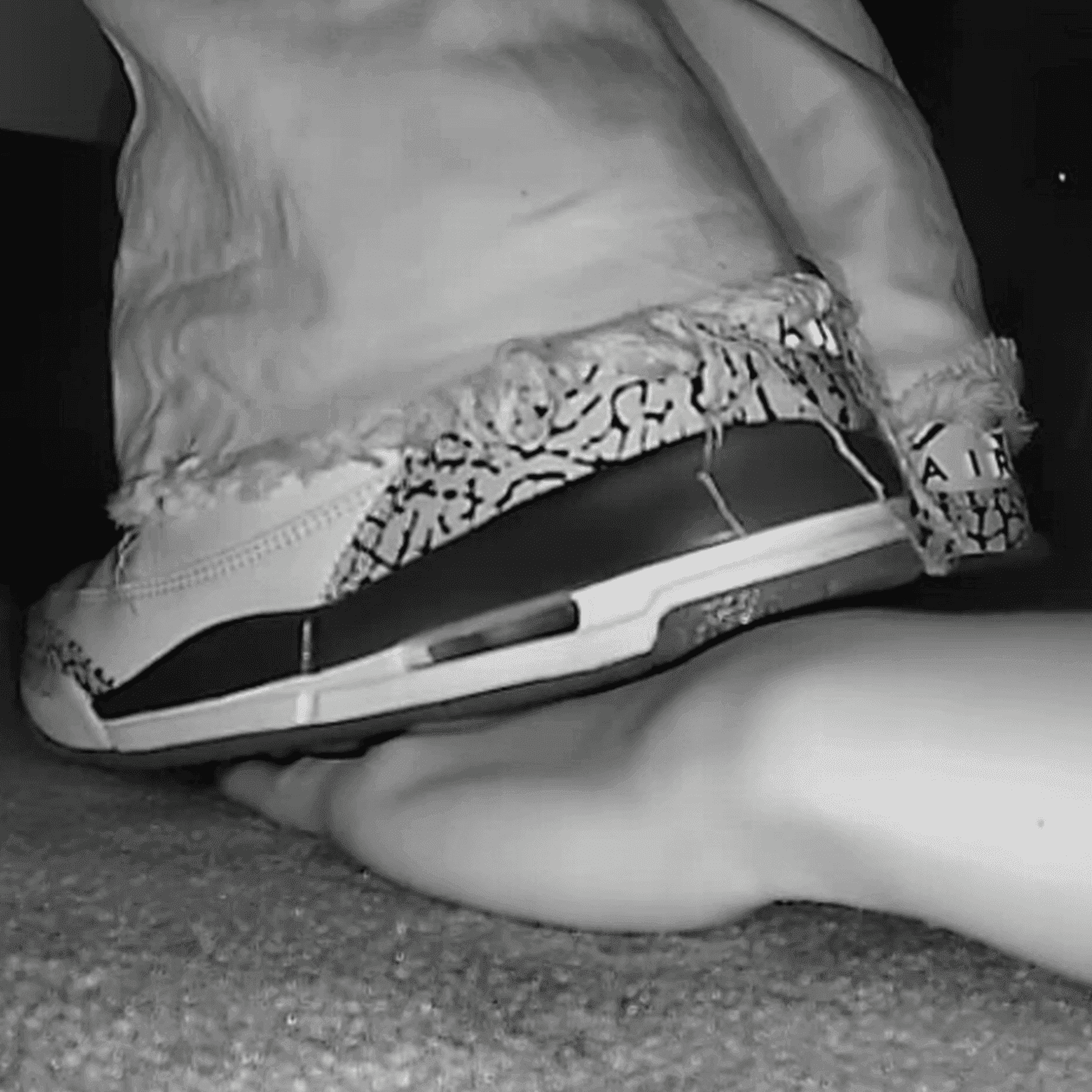 Girl in movie theater candid trample on hand with Nike Air Jordan sneakers