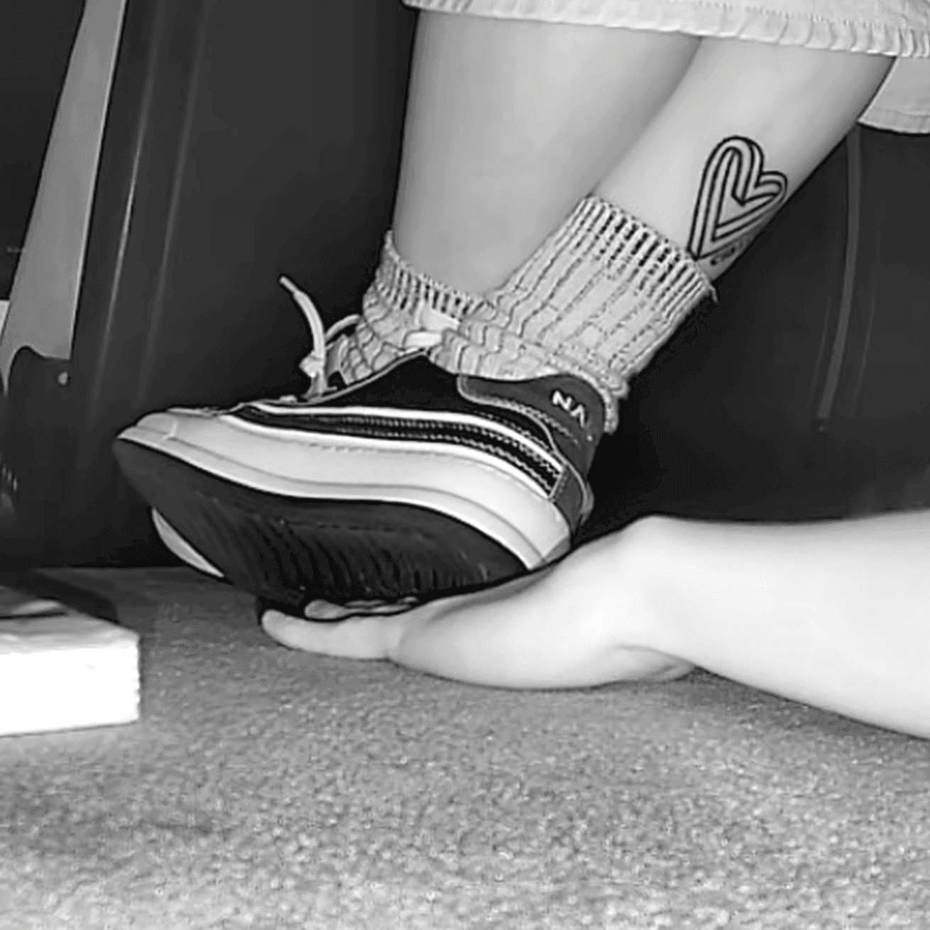 Girl in sneakers candid hand trample at cinema