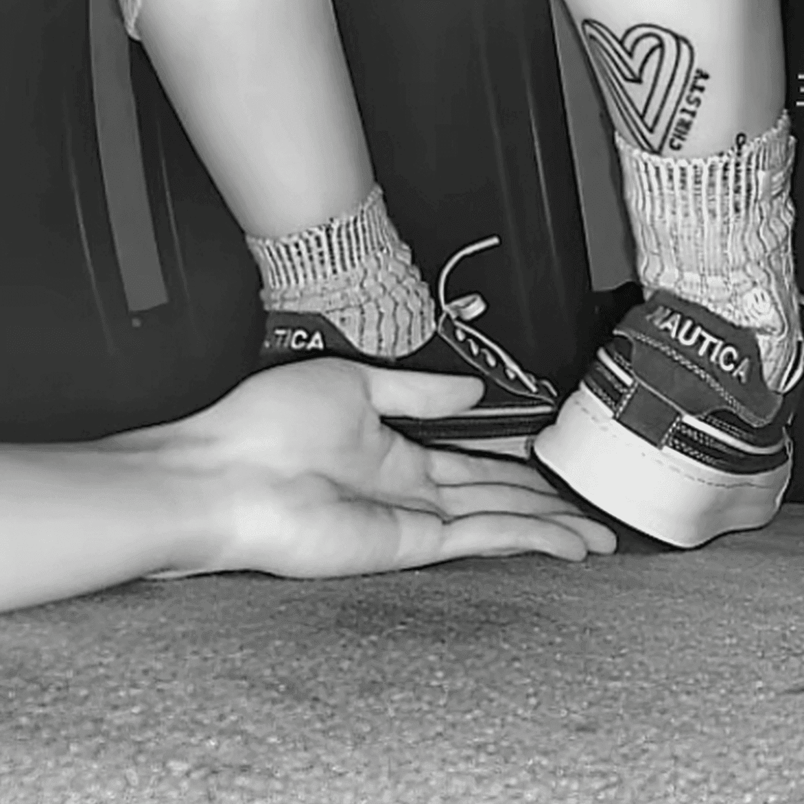 Girl in sneakers candid hand trample at cinema