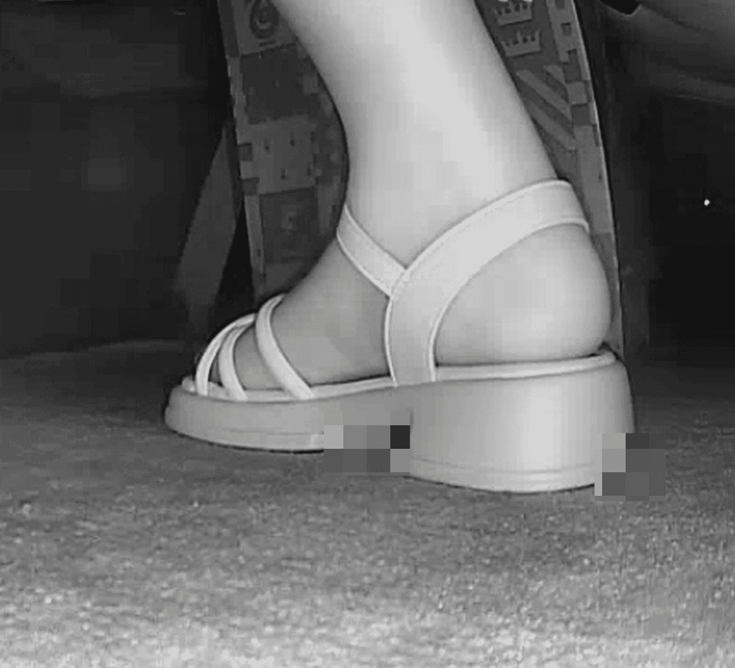Women in movie theater candid crush with white sandals