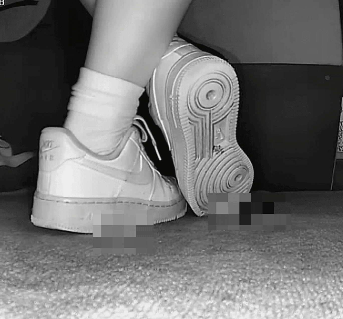 Woman candid crush with white socks and Nike Air Force 1 in cinema