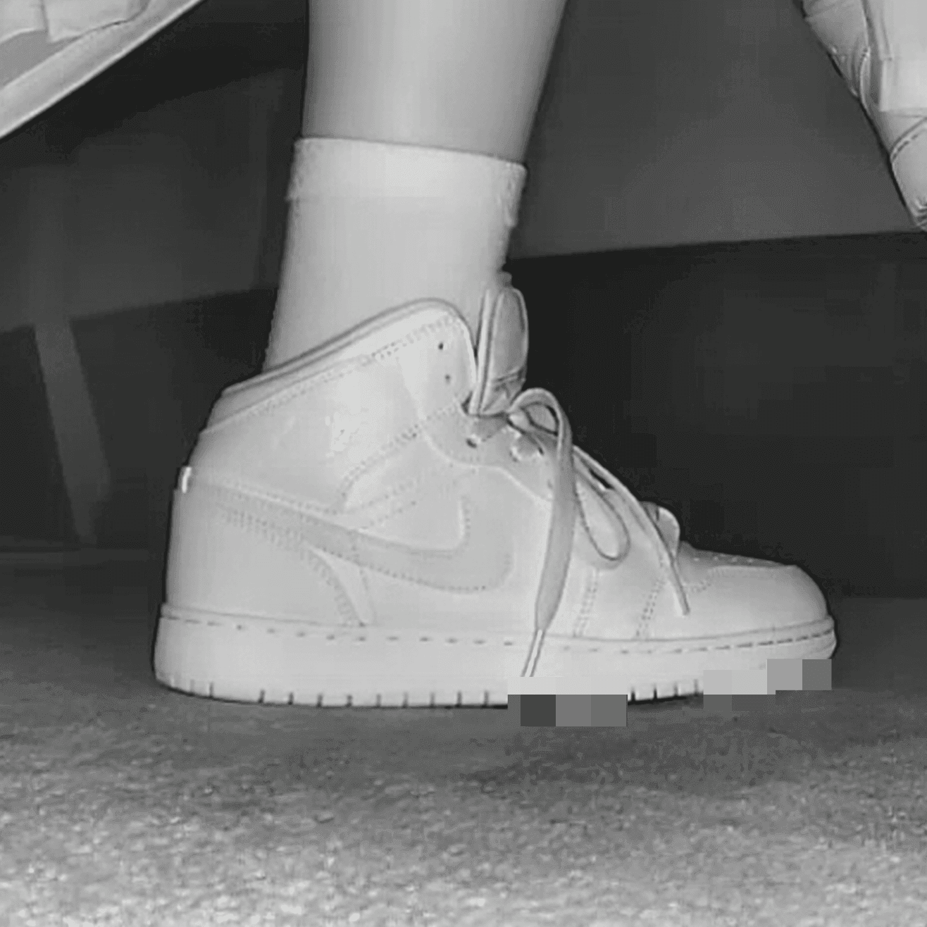 Woman at cinema with white high-top Nike Air Jordan sneakers candid crush