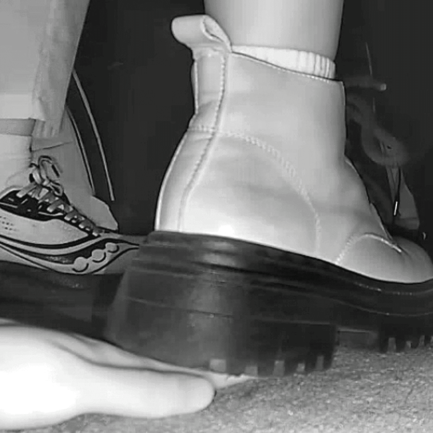 Cinema girl in white socks and Martin boots candid trample on hand