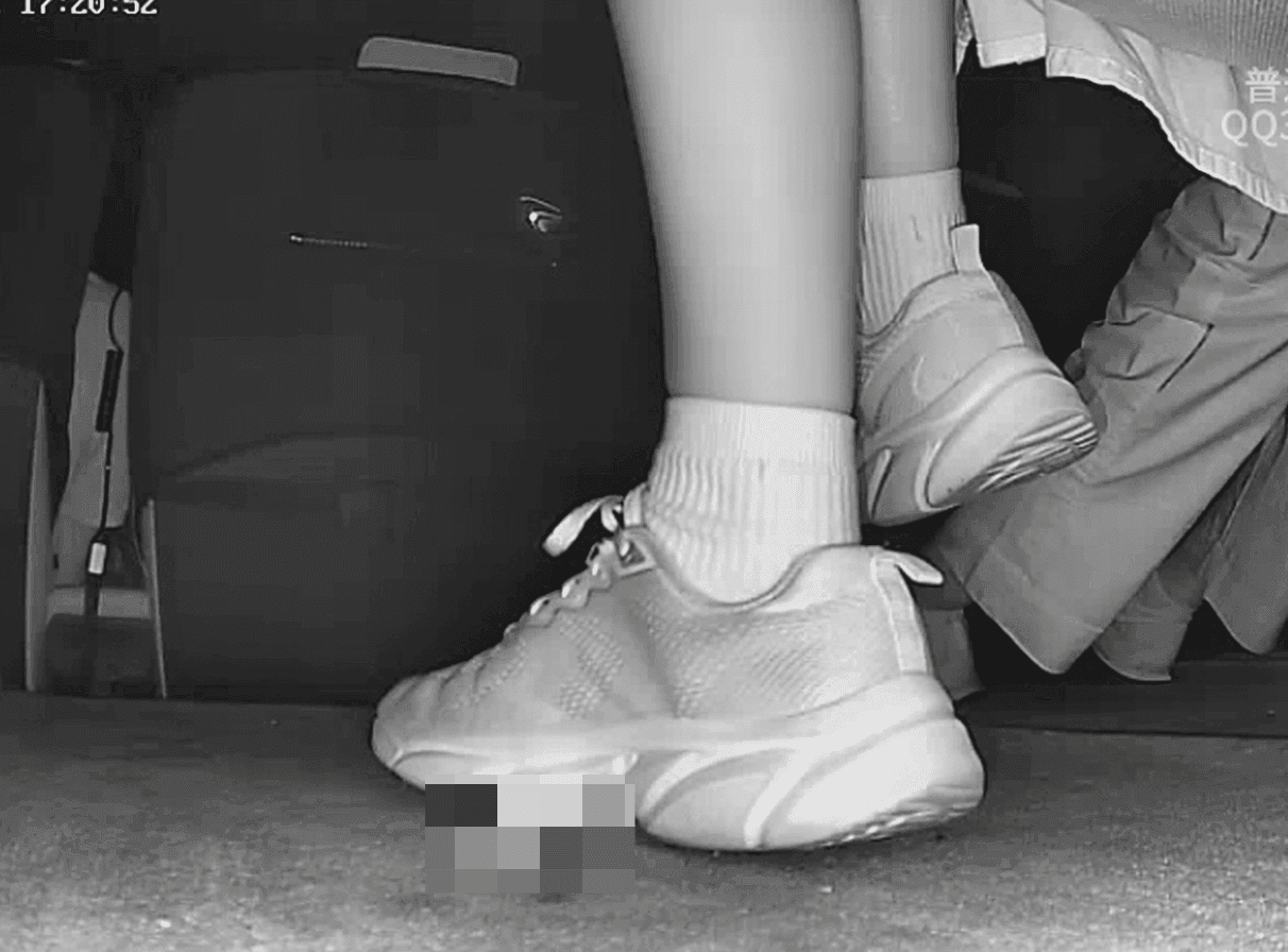 Woman in sneakers and white socks candid crush in movie theater