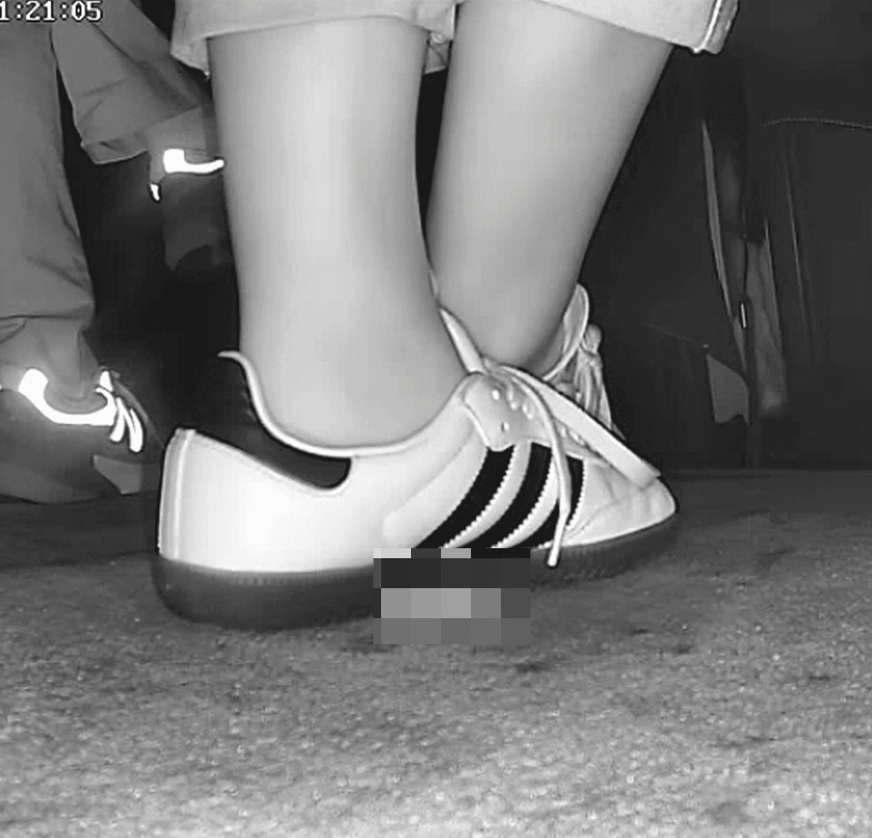 Woman in Adidas Samba sneaker candid crush in movie theater