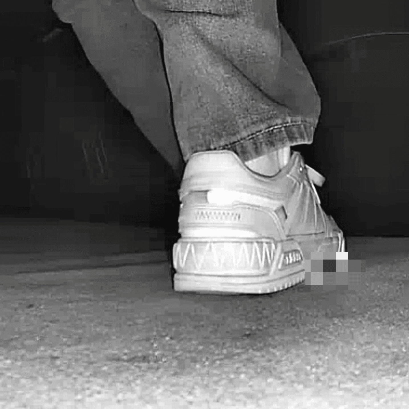 Young woman in cinema candid crush with white sneakers