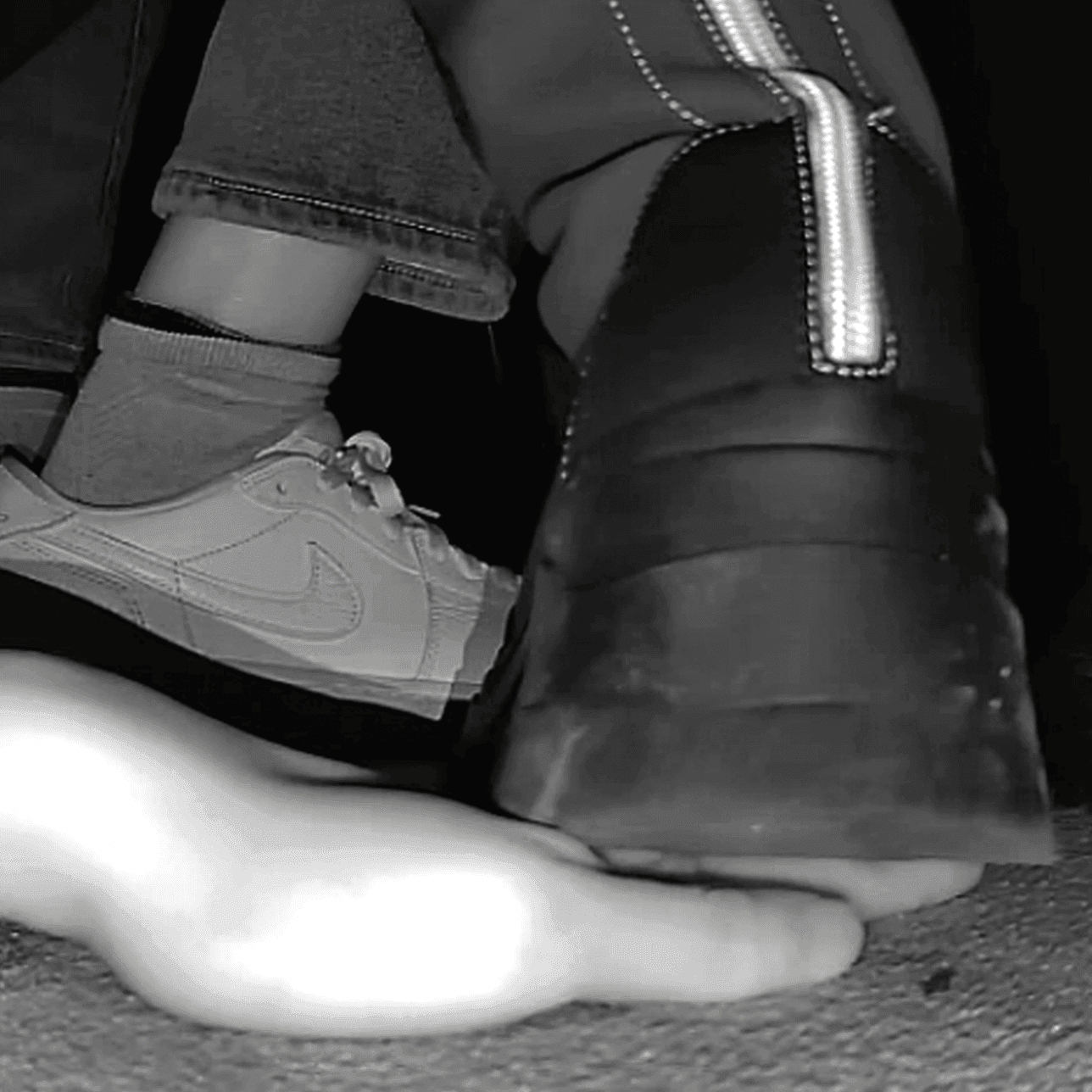 Woman at cinema candid hand trample with chunky-heeled knee-high boots