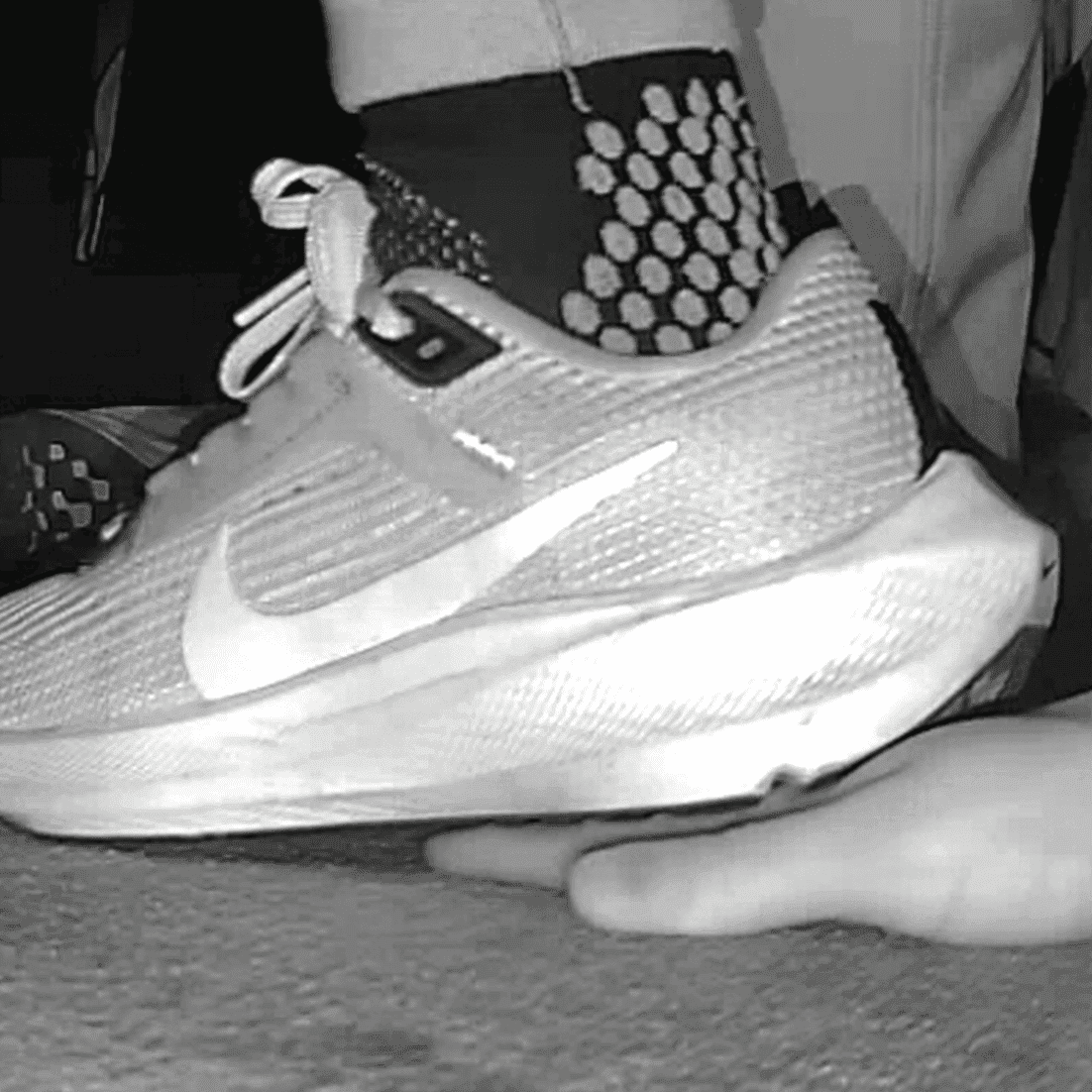 Cinema young girl candid hand trample with Nike running shoes